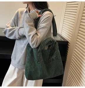 Corduroy tote bag detail view, casual dark green shoulder bag with large capacity.