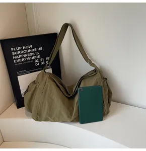 Olive green casual slouchy shoulder bag with adjustable wide strap and large capacity.