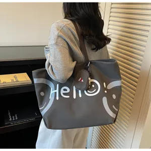Casual grey canvas tote bag with large capacity, shoulder bag for students and commuters.