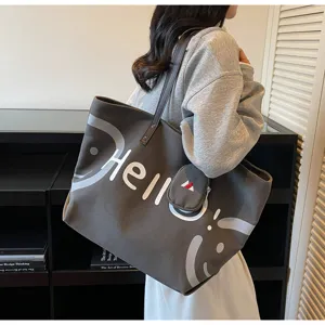 Casual canvas tote bag large capacity shoulder handbag with stylish letter print for daily commute student.