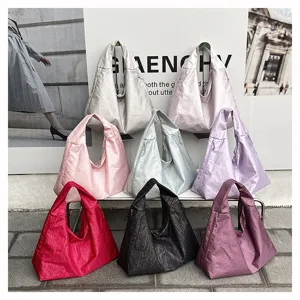 Casual large capacity hobo tote bag for women, versatile crinkled nylon shoulder bag.