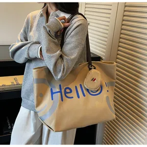 Casual canvas tote bag with large capacity, stylish shoulder bag for daily commute and students.