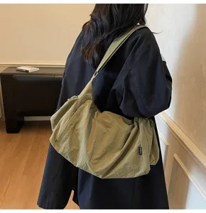Casual large capacity slouchy shoulder bag in khaki, ideal for daily commute and travel.