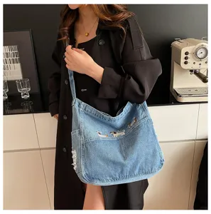 Casual denim shoulder bag for women, trendy embroidered tote with large capacity for daily use.