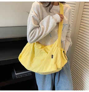 Casual yellow nylon large capacity shoulder bag for women, stylish crossbody tote bag.