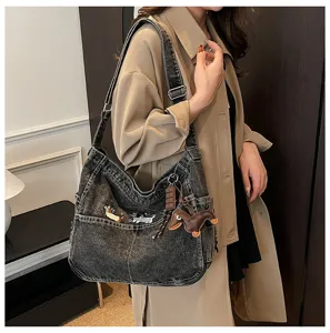 Casual dark gray denim hobo shoulder bag with cute dog embroidery and daily commute tote styling.