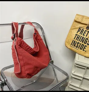 Gewaschene Canvas Umhängetasche mit ausgefransten Kanten, Vintage Schultertasche für Studenten.