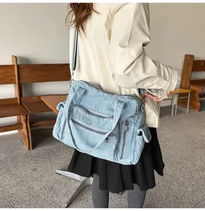 Detailed view of vintage soft denim tote bag with multi pockets and large capacity.