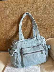 Vintage soft denim tote bag for women, large capacity casual commuter shoulder bag with pockets.