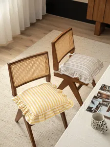 Detail shot of French vintage style striped cotton chair cushion, cozy dining room decor.