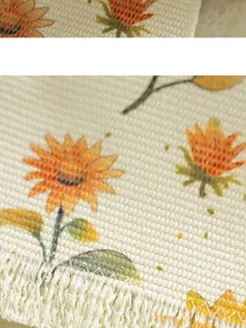 Close-up detail of vintage floral cotton placemat showing woven texture and sunflower print.