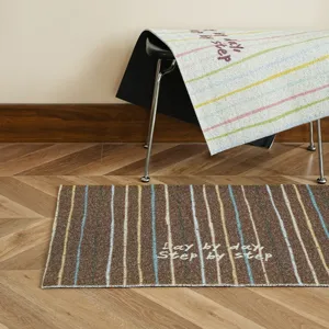 Cozy striped floor mat for entryway with motivational text design, durable and anti-slip.