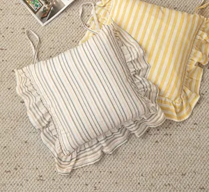 Detail shot of French vintage style striped chair cushions with lovely ruffles and ties.
