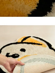 Cute cartoon puppy shaped soft plush absorbent floor mat detail view with anti slip backing.
