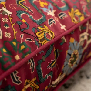 Vintage ethnic style floor cushion detail closeup soft fabric comfortable seat mat decor