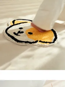 Cute cartoon fluffy floor mat detail showing soft texture and anti-slip backing for bathroom.