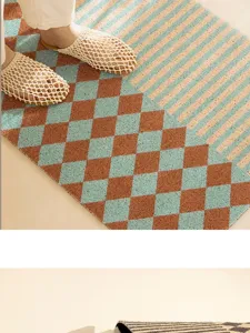 Detailed view of the retro geometric door mat featuring elegant diamond and stripe patterns.
