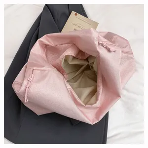 Stylish pink shiny large capacity shoulder bag, casual tote bag for commute and travel.