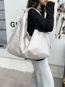 Large silver slouchy hobo shoulder bag, casual commuter tote bag and travel shopping bag.