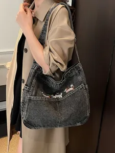 Trendy denim shoulder bag for women, large capacity casual tote with cute dog embroidery.
