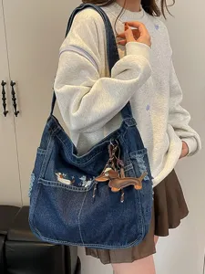 Casual denim shoulder bag with cute dog embroidery and large capacity tote design for women.