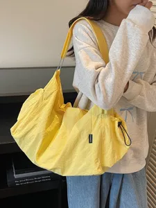 Fashion casual large capacity yellow shoulder bag, versatile commuter travel tote bag for women.