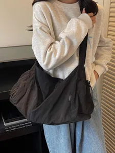 Casual black slouchy shoulder bag for women, large capacity stylish hobo crossbody tote.