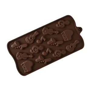 Silicone chocolate mold with 14 musical instrument and note cavities for baking and DIY crafts.