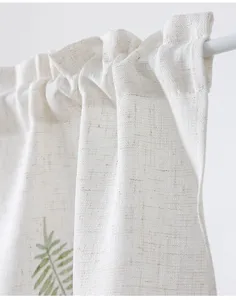 Linen-look fabric curtain detail view, showcasing the textured material and rod pocket hanging.