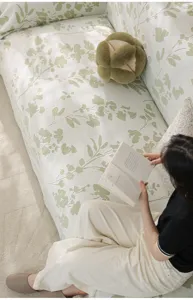 Detailed view of summer cooling ice silk sofa cover featuring elegant botanical leaf print design.