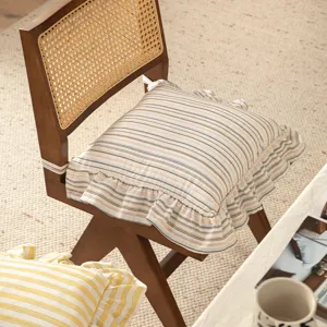 Cotton chair pad with vintage striped design and ruffled edge for dining room chairs.