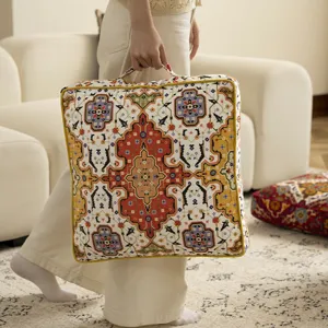 Vintage ethnic style cushion seat pad with handle, comfortable floor tatami decor detail.