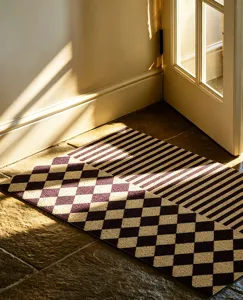 Detailed view of retro checkered and striped doormat, anti-slip entrance floor mat for home decor.