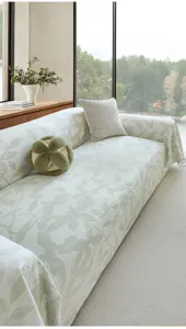 Summer cooling ice silk sofa cover detail, elegant green leaf print fabric for modern home.