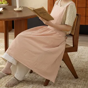 Cotton kitchen apron for women, pink sleeveless coverall with pocket, cozy home cooking wear.