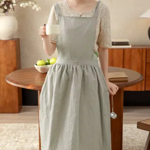 Cotton kitchen apron for women, stylish sleeveless cooking coverall with pocket, light green.