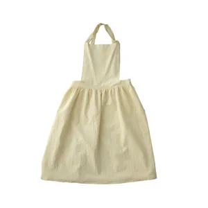 Comfortable cotton women's apron with pockets, stylish sleeveless design for kitchen cooking and baking.