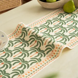 Gewebter Baumwoll-Tischläufer mit Palmen-Print und Blumenrand für die Esstischdekoration.