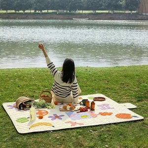 Thickened waterproof picnic mat with cute cartoon fruit pattern, perfect for outdoor camping.