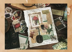Detail view of vintage journaling material paper pack with retro botanical stickers and stamps.