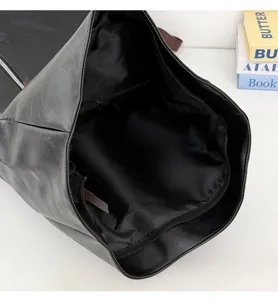 Large capacity black roll top backpack interior view, casual commute computer bag.