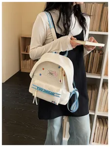 Grazioso zaino in tela bianca con spallacci a righe blu e ricami di stelle per donne.