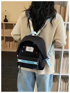 Zaino nero in tela con stelle e bretelle blu, grande borsa casual per donne e ragazze.