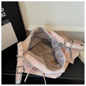 Pink slouchy shoulder tote bag detail, soft leather interior striped lining and metal hardware.