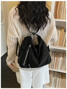 Casual retro large capacity slouchy convertible backpack shoulder tote bag for daily commute.