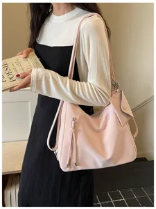 Detail shot of the versatile pink soft hobo shoulder bag with convertible straps and zipper.