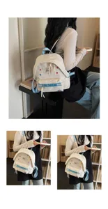 Grazioso zaino in tela bianca con spallacci blu e stelle per la scuola e il lavoro.