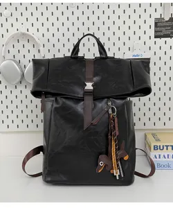 Black PU leather roll-top backpack with brown straps and dog keychain for daily school commute.
