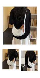 Detailed view of the Korean style white crescent shoulder bag with cute bear charm for daily wear.