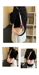 Korean retro pink shoulder bag, chic crescent crossbody purse with cute heart charm for daily.